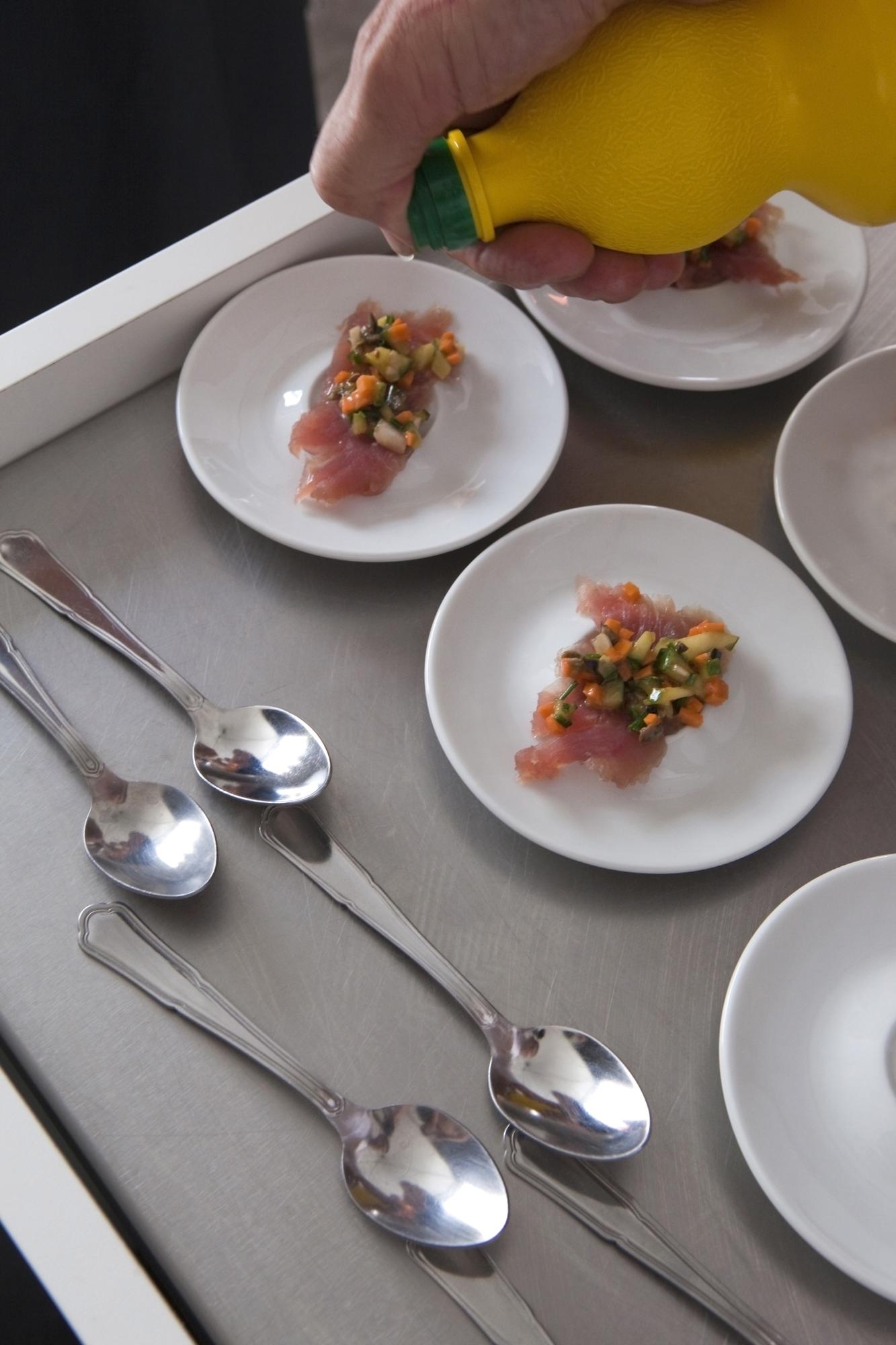 Small professional kitchen with plated dishes